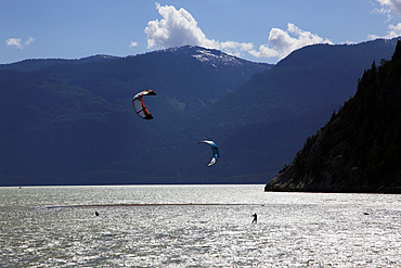 Two kite surfers on Howe Sound at Squamish, British Columbia, Canada, North America