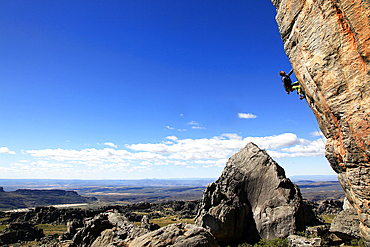 A rock climber scales a difficult route at Rocklands, Western Cape, South Africa, Africa