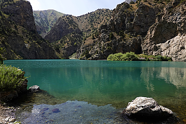 Turquoise water in lake in the remote and spectacular Fann Mountains, part of the western Pamir-Alay, Tajikistan, Central Asia, Asia