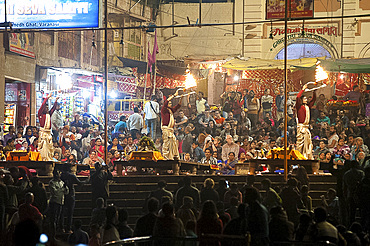 Hindu devotees taking part in the sacred ceremony of evening aati, adoration of the holy River Ganges, Varanasi, Uttar Pradesh, India, Asia