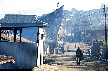 Naga villagers in the early morning, going about their business in Chanlangshu Naga village, Nagaland, India, Asia