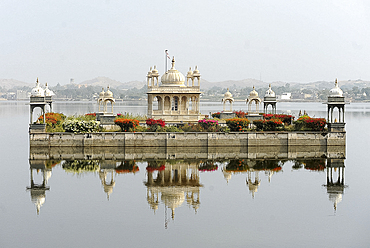 Vijay Raj Rajeshwar temple, reflected in the waters of the Gaibsagar Lake, built in 1923, dedicated to Lord Shiva, Dungarpur, Rajasthan, India, Asia