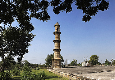 Single minaret remaining on a high plinth from Bahadur Shah's mosque built between 1526-36, Champaner, Gujarat, India, Asia