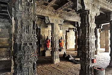 Two dressed deities at shrine inside pillared hall in 11th century Gangaikonda Cholapuram temple, UNESCO World Heritage Site, Ariyalur district, Tamil Nadu, India, Asia