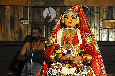 Contemporary female performer in a Kathakali dance depicting folk mythologies from the Hindu epics, Nilambur, Kerala, India, Asia