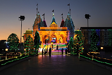 Diwali festival lights illuminating the entrance to the white marble Swaminarayan Temple, Mandvi, Gujarat, India, Asia