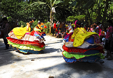 Group of Chaiti Ghoda (Dummy Horse) dancers performing traditional dance at rural village event, Odisha, India, Asia