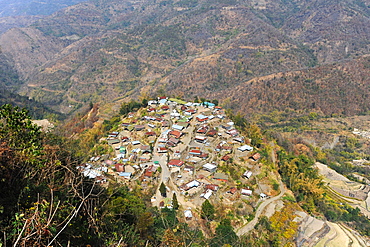 View across the slopes of the Naga hills and small Naga village, Phek district, Nagaland, India, Asia