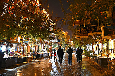 People walking in the main street at night, Old Kashgar, Xinjiang, China, Asia