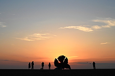 People watching sunrise beside The Scallop, sculpture by Maggi Hambling 2003, commemorating Benjamin Britten, Aldeburgh, Suffolk, England, United Kingdom, Europe