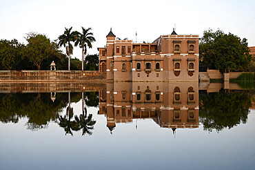 Sri Joravar Vilas reflected in the still waters of the lake, swallows nests made beneath its windows, Santrampur, Gujarat, India, Asia