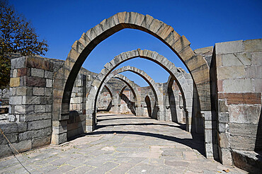 Five arches, the remains of 15th century hilltop Saat Kaman (Seven Arches) monument, part of the Champaner complex, Gujarat, India, Asia