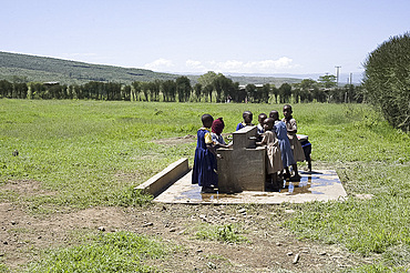 Fresh water tank supplies clean drinking water to schoolchildren at Ndogo Primary School, Gilgil district, Rift Valley, Kenya, East Africa, Africa