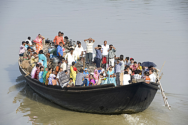 Crowded village ferry crossing the River Hooghly, West Bengal, India, Asia