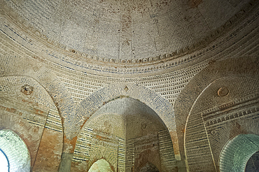 Domed interior and arches of the 15th century Lattan mosque, showing alternating horizontal bands of bricks, Gaur, West Bengal, India, Asia