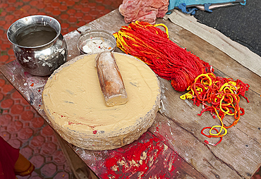 Sandalwood paste for tilaks, and kumkum, the sacred combination of holy thread and coloured powder, Sonepur, Bihar, India, Asia