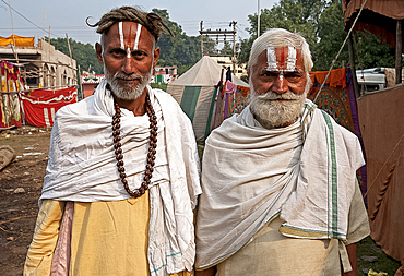 Two men with Vaishnavite sandalwood tilaks on their foreheads, one man with long uncut hair, Sonepur Cattle Fair, Bihar, India, Asia