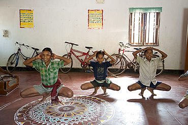 Young boys being trained as female Gotipua dancers performing in praise of Lord Jagannath and Lord Krishna, Raghurajpur, Orissa, India, Asia