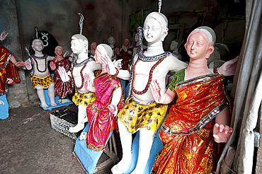 Finished, painted and dressed deities ready for offering at festival pujas, Kumartuli district, Kolkata, West Bengal, India, Asia