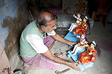 Sculpture with small painted and dressed deities ready for offering at festival pujas, Kumartuli district, Kolkata, West Bengal, India, Asia