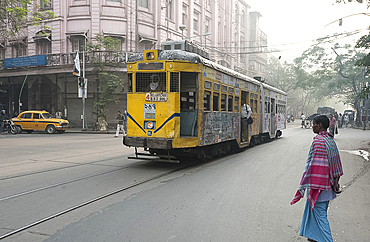 Kolkata traffic including street tram and taxi in the early morning, Kolkata (Calcutta), West Bengal, India, Asia