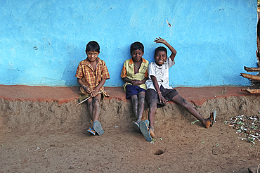 Three mischievous boys in Mali tribal village, Jeypore district, Orissa, India, Asia