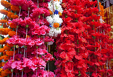 Hibiscus garlands (mala) hanging outside Kamakhya Hindu temple in Guwahati, Assam, India, Asia