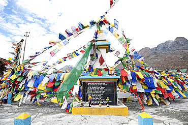 Buddhist prayer flags flapping in the wind at the Sela Mountain Pass at 13700 feet, Tawang district, Arunachal Pradesh, India, Asia