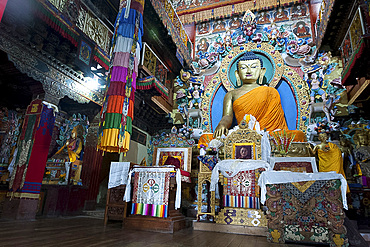 Large Buddha shrine in prayer hall, with photograph of the Dalai Llama, Tawang monastery, Arunachal Pradesh, India, Asia