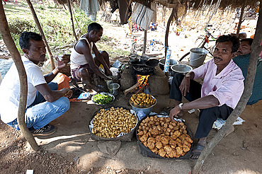 Bhaji and savoury snack stall in Mali weekly tribal market, Guneipada, Koraput district, Orissa (Odisha), India, Asia