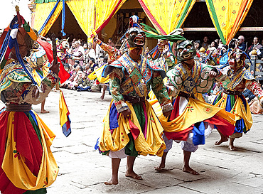 Monks in costume and animal masks performing ceremonial dance at Paro Tsechu (annual festival), Paro Dzong (monastery), Paro, Bhutan, Asia