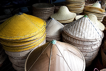 Burmese hats hand made from bamboo leaves and grasses, for sale in roadside market on Mandalay Road, Myanmar (Burma), Asia