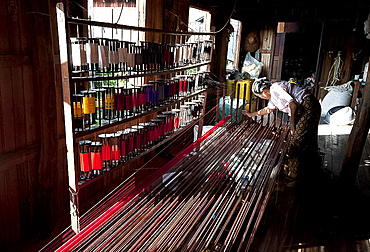 Woman arranging silk threads by colour at Ko Than Hlaing Weaving workshop, Inpawkhon, on Inle Lake, Shan state, Myanmar (Burma), Asia