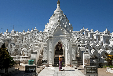 Woman outside Hsinbyume (or Myatheindan) Pagoda, modelled on the description of the Buddhist mythological Mount Meru, Mingun, Myanmar (Burma), Asia