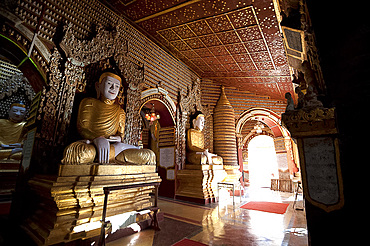 Thanboddhay Pagoda, showing some of the 100000 Buddhas there, large and small lined up on shelves, Monywa, Sagaing Division, Myanmar (Burma), Asia