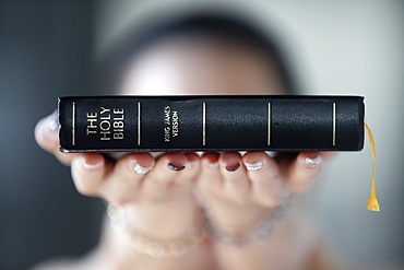 Catholic woman with the Holy Bible in hands, Vietnam, Indochina, Southeast Asia, Asia