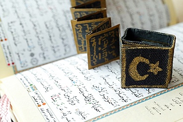 Close-up of Quran, crescent, star and surats, Muslim symbols, Vietnam, Indochina, Southeast Asia, Asia