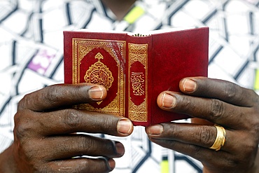 African Muslim man reading the Quran, Lome, Togo, West Africa, Africa