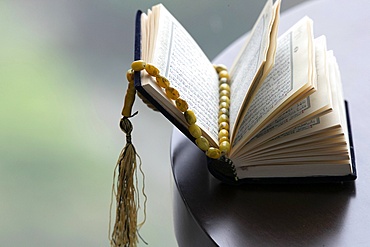 An open Holy Quran and Muslim prayer beads, Ho Chi Minh City, Vietnam, Indochina, Southeast Asia, Asia