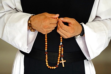 Close-up of monk's hands praying the Rosary, Cistercian Abbey, Our Lady of My Ca, Vietnam, Indochina, Southeast Asia, Asia