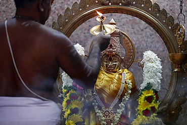 Hindu priest doing puja worship, Durga, Hindu Goddess of War, Sri Mahamariamman Hindu Temple, Kuala Lumpur. Malaysia, Southeast Asia, Asia