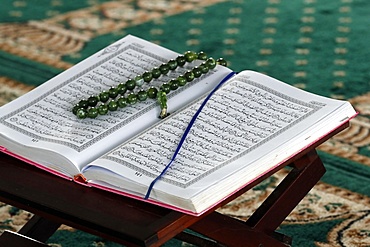 Open Quran and Muslim prayer beads on wood stand, Masjid Ar-Rohmah Mosque, Chau Doc, Vietnam, Indochina, Southeast Asia, Asia