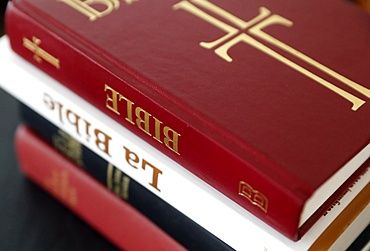 Four different Bibles on a table, France, Europe