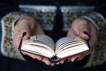 Muslim woman reading the Noble Quran, United Arab Emirates, Middle East