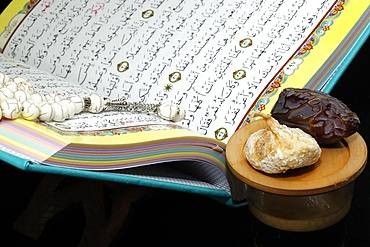 Holy Quran book with prayer beads and date, Ramadan concept, Muslim faith and religion, France, Europe