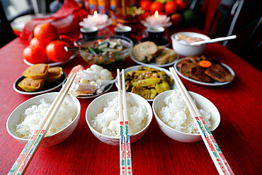 Chinese Lunar New Year, Vietnamese Tet celebration, food and offerings on table, religion at home, Haute Savoie, France, Europe