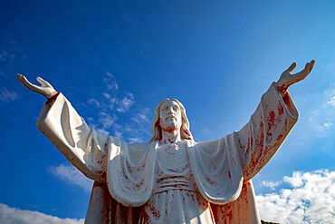 Statue of Jesus Christ with open arms in Delaj, Montenegro, Europe