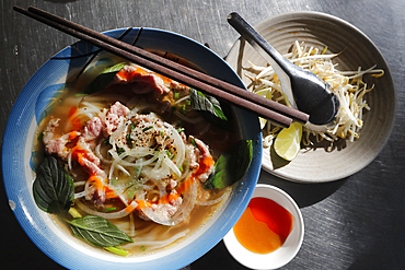 Bowl of Vietnamese traditional pho chicken noodle soup in a street restaurant, Tan Chau, Vietnam, Indochina, Southeast Asia, Asia