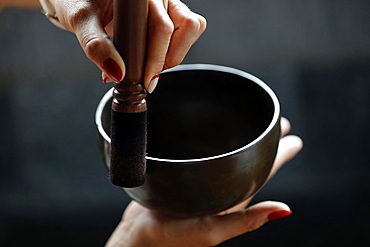 Bowl in the hands of prayer, Tibetan singing bowl, Buddhist instrument used in sound therapy, meditation and yoga, Quang Ninh, Vietnam, Indochina, Southeast Asia, Asia