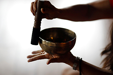 Bowl in the hands of prayer, Tibetan singing bowl, Buddhist instrument used in sound therapy, meditation and yoga, Quang Ninh, Vietnam, Indochina, Southeast Asia, Asia